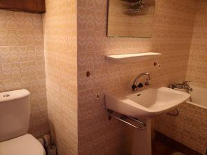 a bathroom with a toilet and a sink at Appartement studio à Notre-Dame-de-Bellecombe - 4 personnes NDB102-04G4 in Notre-Dame-de-Bellecombe