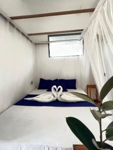Postel nebo postele na pokoji v ubytování Monstera Haven Hiriketiya