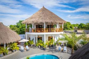 an aerial view of a resort with a swimming pool at TinJaLa Lodge in Brufut