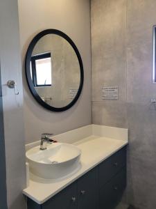 a bathroom with a sink and a mirror at Riverview House Sedgefield in Sedgefield +31 photos