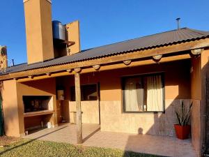 a house with a porch and a window on it at La Casita El Martillo in Concordia