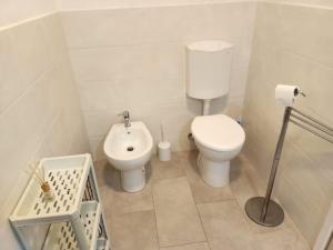 a small bathroom with a toilet and a bidet at Vista Bella House in Sanremo +20 photos