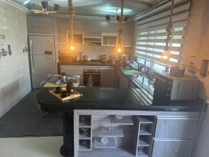 a kitchen with a island in the middle of it at Location villa vacances sur tanger in Tangier