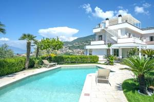 a villa with a swimming pool and a house at Luxury Levaina Villa Sleeps 8 on the Amalfi Coast in Positano