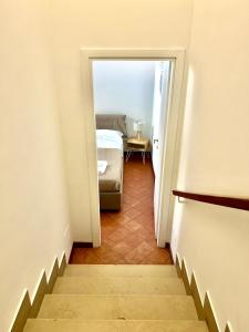 a stairway leading to a bedroom with a bed at Linda Charme in Rome +2 photos