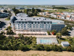 an aerial view of a resort with a pool at Westotel Le Pouliguen in Le Pouliguen