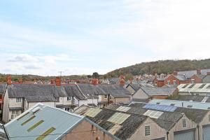 an aerial view of a town with houses and roofs at Colwyn Bay Two Bedroom Apartment by Guestz in Colwyn Bay