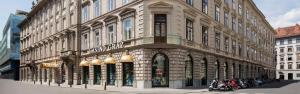 a large building with motorcycles parked in front of it at TOP Ferienwohnung Rosanna - Adults only in Graz
