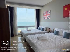 Ένα ή περισσότερα κρεβάτια σε δωμάτιο στο Jully Vung Tau Grand Strip 1 +67 φωτογραφίες