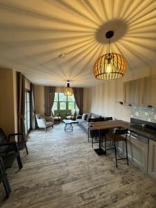 a kitchen and living room with a table and chairs at Valinor Urla in Urla +55 photos