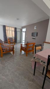 TV a/nebo společenská místnost v ubytování Bitare Appartements