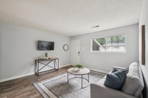 a living room with a couch and a table at Kenridge Apartments 1230 I Comfy 2 Bed 2 Bath in Decatur