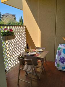 a table and chairs sitting on a patio at Pia's house in Rome