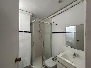 a bathroom with a shower and a sink at AmazINN Places Casa Calabuig Ático Marina Real - No Ascensor- in Valencia +12 photos
