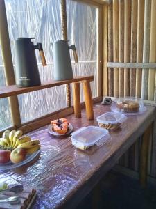 a table with food on top of it at Odara Glamping-Jalapão in Mateiros