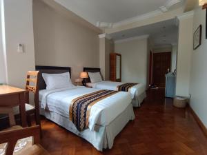Postelja oz. postelje v sobi nastanitve Grand Laurel Hotel