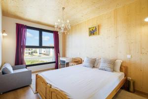 a bedroom with a large bed and a window at Victoria Atlantica in Sagres +35 photos