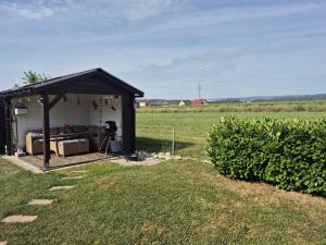 a gazebo in the middle of a field at Ferienwohnung Irina Legoland ca 30 km in Gerstetten