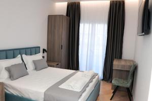 Postel nebo postele na pokoji v ubytování Joni`s Guesthouse