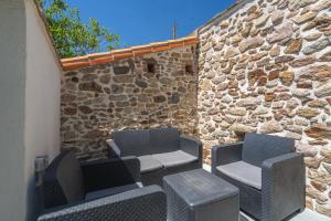 Χώρος καθιστικού στο LE RELAIS DU ROY - Maison proche Cholet et Puy dufou
