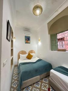 Letto o letti in una camera di Riad Green Vines