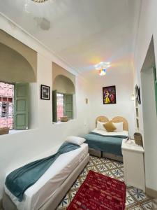 Letto o letti in una camera di Riad Green Vines