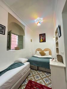 Letto o letti in una camera di Riad Green Vines