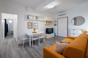 a living room with a couch and a table at Italian Experience- Aselli Home in Pavia