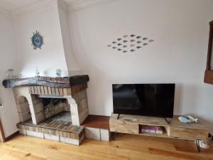 TV a/nebo společenská místnost v ubytování Vila Âncora Beach House 1