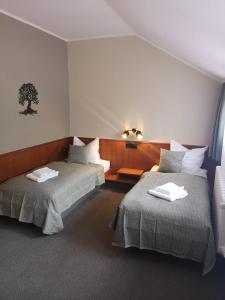 Ein Bett oder Betten in einem Zimmer der Unterkunft Hotel Burgblick Meißen