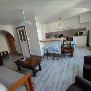 a living room with a couch and a table at Autun cœur de ville in Autun