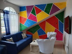 Posezení v ubytování VILLA CON PISCINA en los jardines Boca Chica