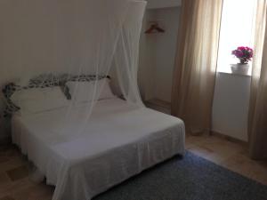 Postel nebo postele na pokoji v ubytování Gelsomoro beach house