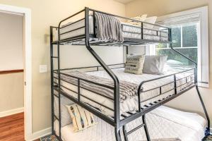 a black bunk bed in a room with a window at Modern Tims Ford Lake Home with Private Dock and Pool! in Lynchburg +30 photos