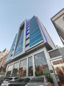 a building with cars parked in front of it at فندق برام - Bram Hotel in Jeddah
