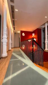 a pool in a room with white columns at Literal Hostel Madrid in Madrid