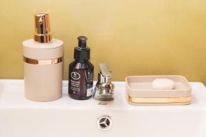 a bathroom counter with a bottle of soap and a blender at Swarna Nature Villa in Kandy +54 photos