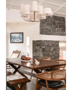 a dining room with a wooden table and chairs at Hillside Home 3 BHK Villa by tisyastays in Yedapalli