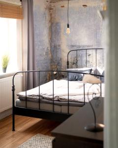 Ένα ή περισσότερα κρεβάτια σε δωμάτιο στο BarnLoft mit Whirlpool & Kamin