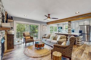 a living room with a couch and a table at Bee Branch 05 in Sugar Mountain