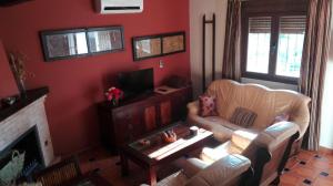 Coin salon dans l'établissement Alojamiento Turistico Rural El Yelmo