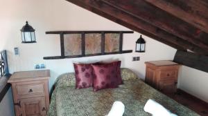 Un ou plusieurs lits dans un hébergement de l'établissement Alojamiento Turistico Rural El Yelmo