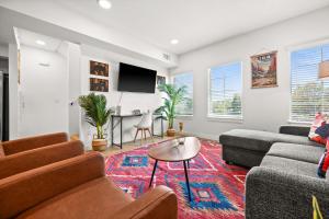 a living room with a couch and a table at SLC Townhome King BD 2 Car Garage in Salt Lake City