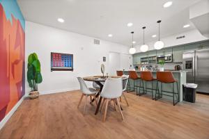 a kitchen and dining room with a table and chairs at SLC Townhome King BD 2 Car Garage in Salt Lake City +36 photos