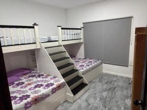 two bunk beds in a room with a staircase at Rancho El Valle in Acajutla +15 photos
