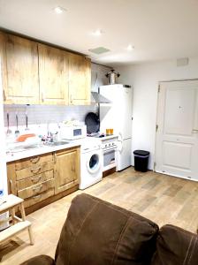 a kitchen with a sink and a stove top oven at Casa de campo in Illana