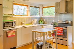 a kitchen with white cabinets and a counter top at Quiet place with easy access NYC in River Edge