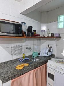 Kuchyň nebo kuchyňský kout v ubytování Apartamento Centro Arraial do cabo