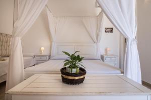 Postel nebo postele na pokoji v ubytování Antica Masseria Ficazzana - Tenuta