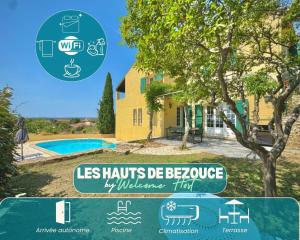 un cartello di fronte a una casa con un edificio di Les Hauts de Bezouce, Vue, Piscine & Calme a Bezouce